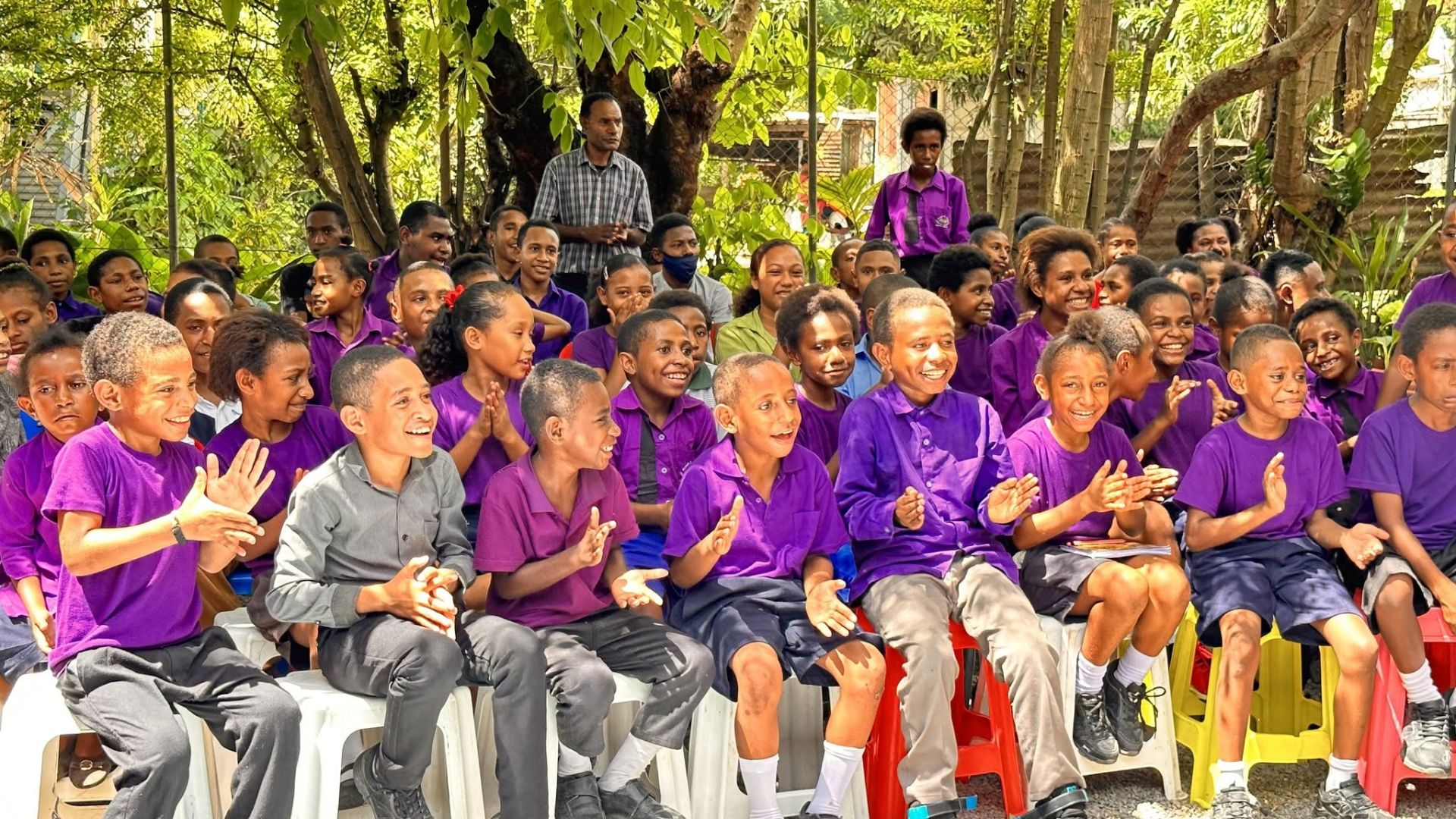 AOCA students in their purple uniforms